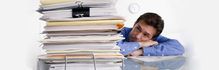 Businessman Overwhelmed with Paperwork